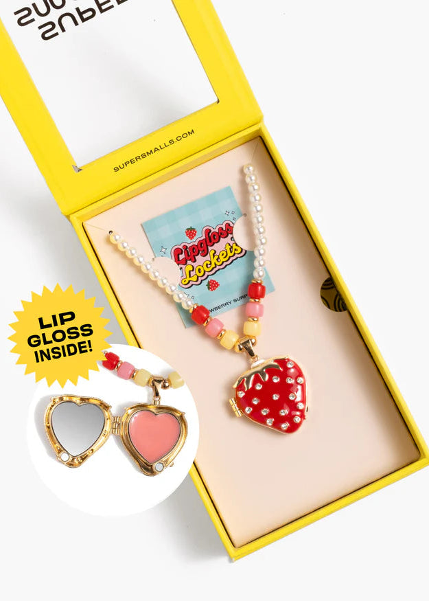 Colorful lip gloss set with heart-shaped mirror and strawberry design in a yellow box.