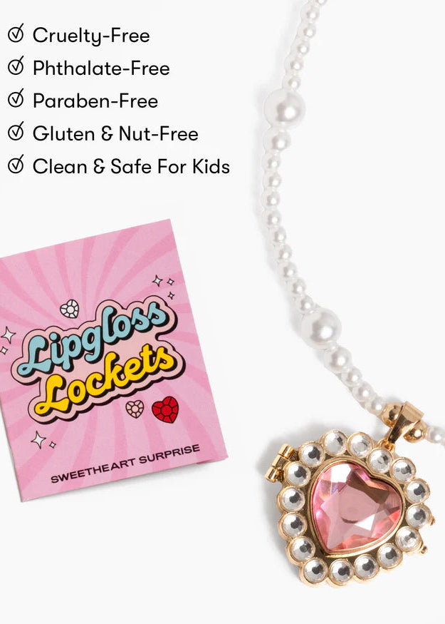 Lipgloss Lockets necklace with pink heart locket and packaging on a white background