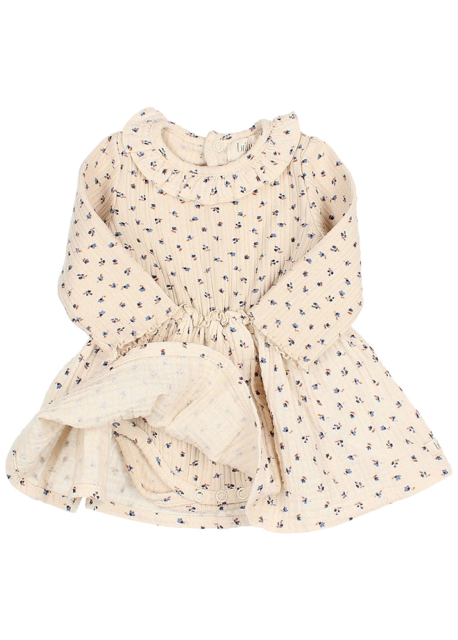 Beige floral dress on a white background
