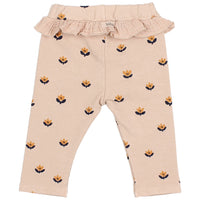 Beige baby leggings with floral pattern and ruffled waistband on a white background