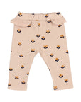 Beige baby pants with floral pattern on a white background