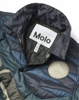 Close-up of a jacket with a Molo label on a white background