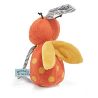 Plush toy resembling a ladybug with an orange body and yellow spots on a white background