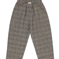 Plaid patterned pants on a white background