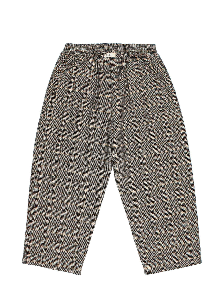 Plaid patterned pants on a white background