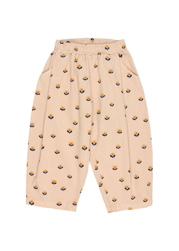 Beige pants with small pattern on a white background