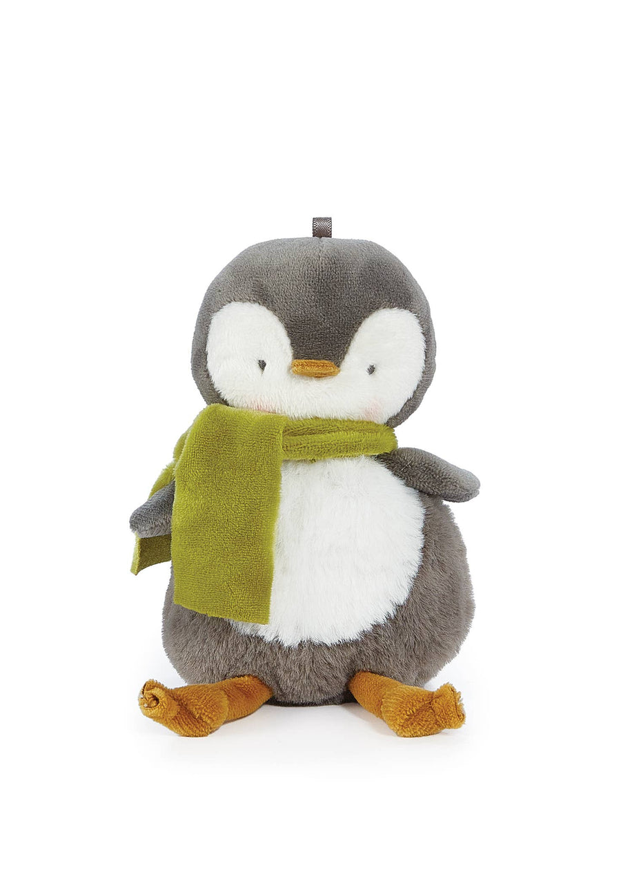 Plush penguin toy with a green scarf on a white background