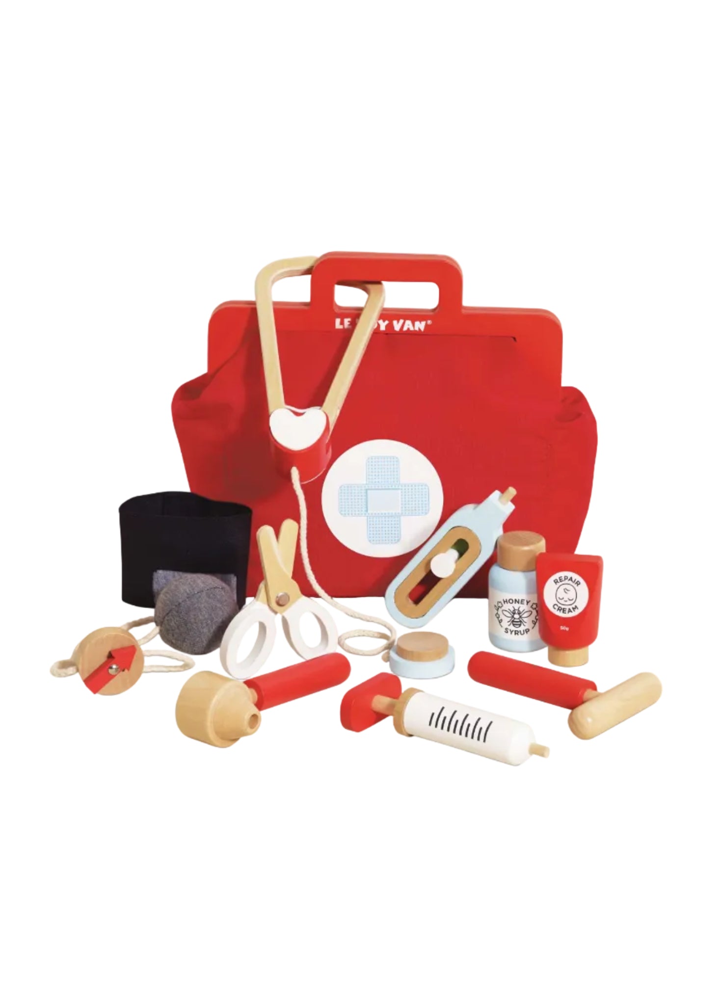 Red toy first aid kit with various medical tools on a white background