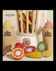 Wooden toy set with colorful fruits and a white container labeled 'Child Safe Paints'.