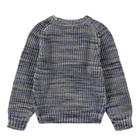 Back view of a patterned sweater on a white background