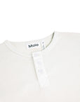 Close-up of a white garment with 'Molo' branding on a white background