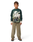 Child wearing a green sweatshirt with a moose graphic on a white background