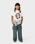 Child wearing a white t-shirt with a colorful graphic and gray pants on a white background