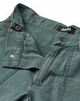 Green jacket with 'Molo' brand label on a white background