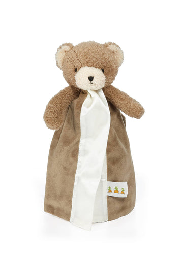 Brown teddy bear with a white blanket on a white background