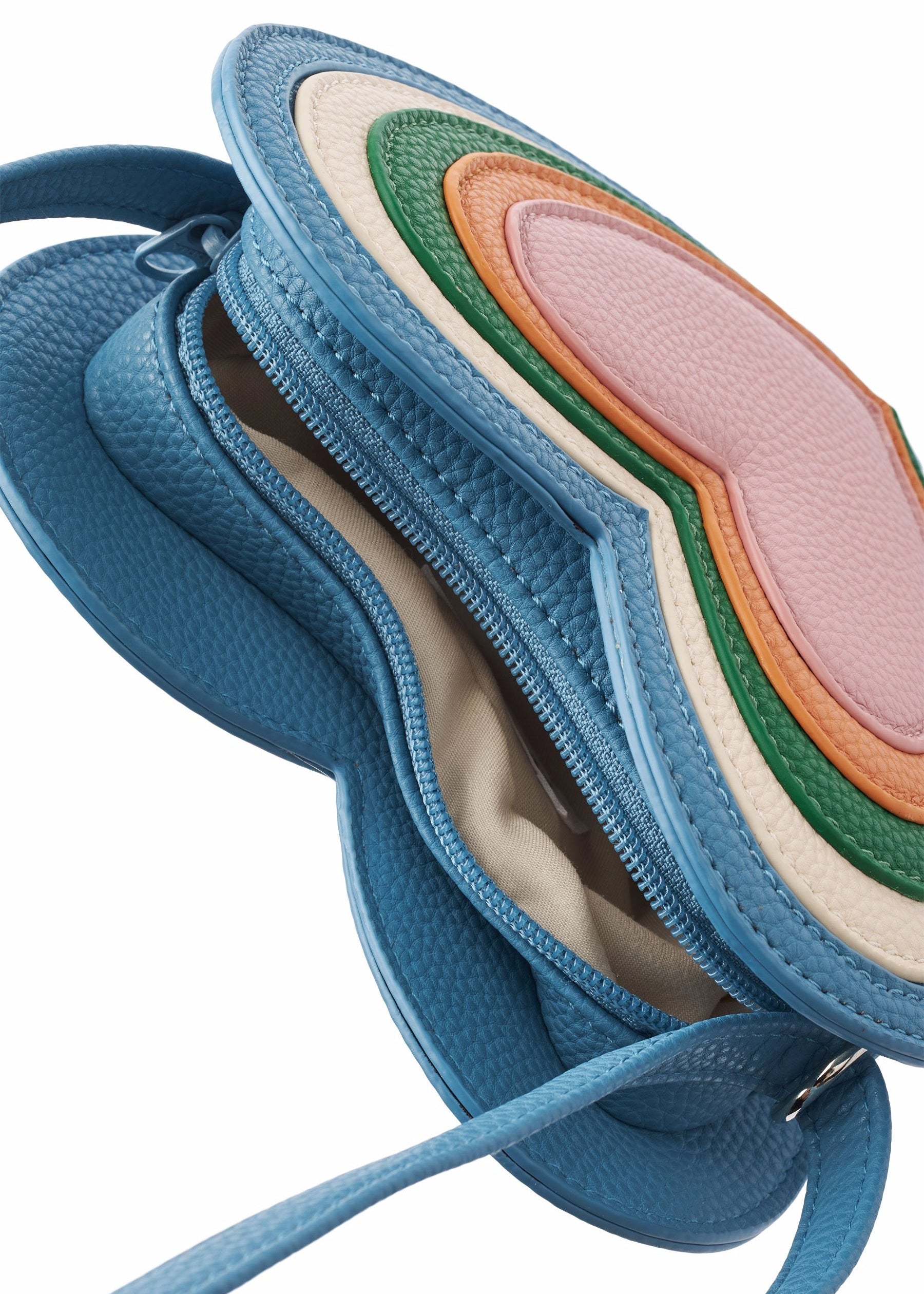 Blue handbag with a colorful interior on a white background