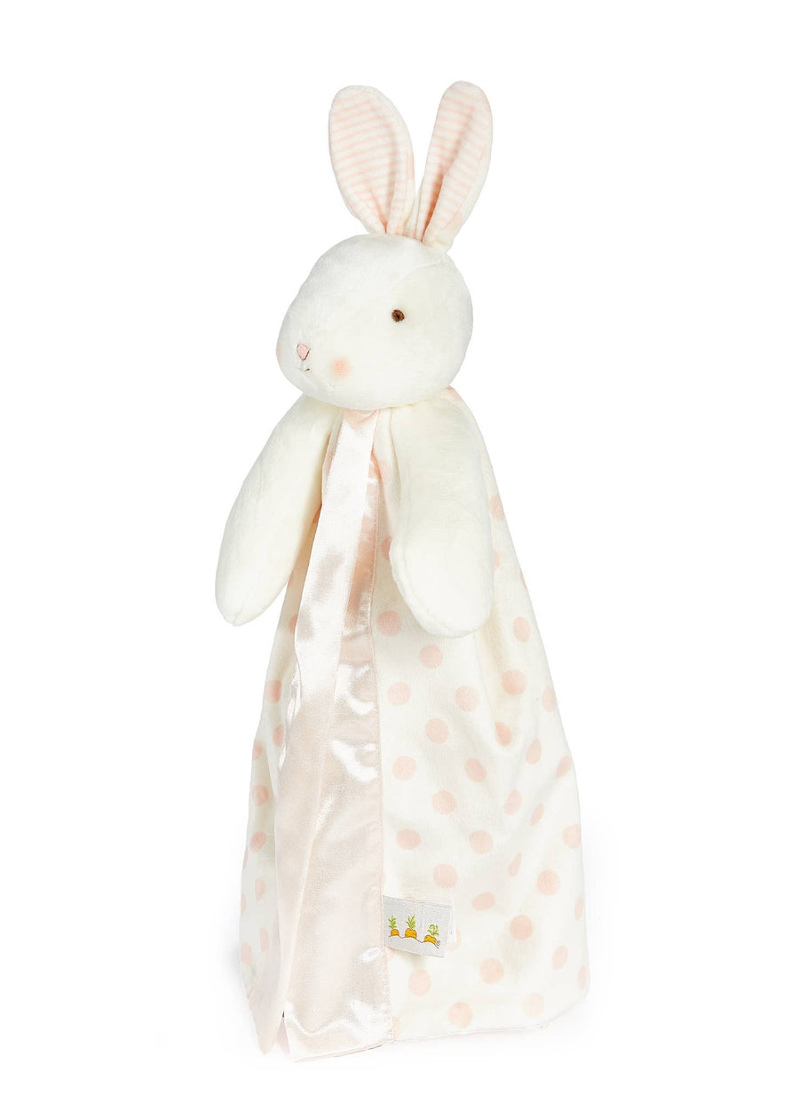 White bunny plush toy with a polka dot blanket on a white background