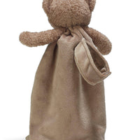 Brown teddy bear wrapped in a matching brown blanket on a white background