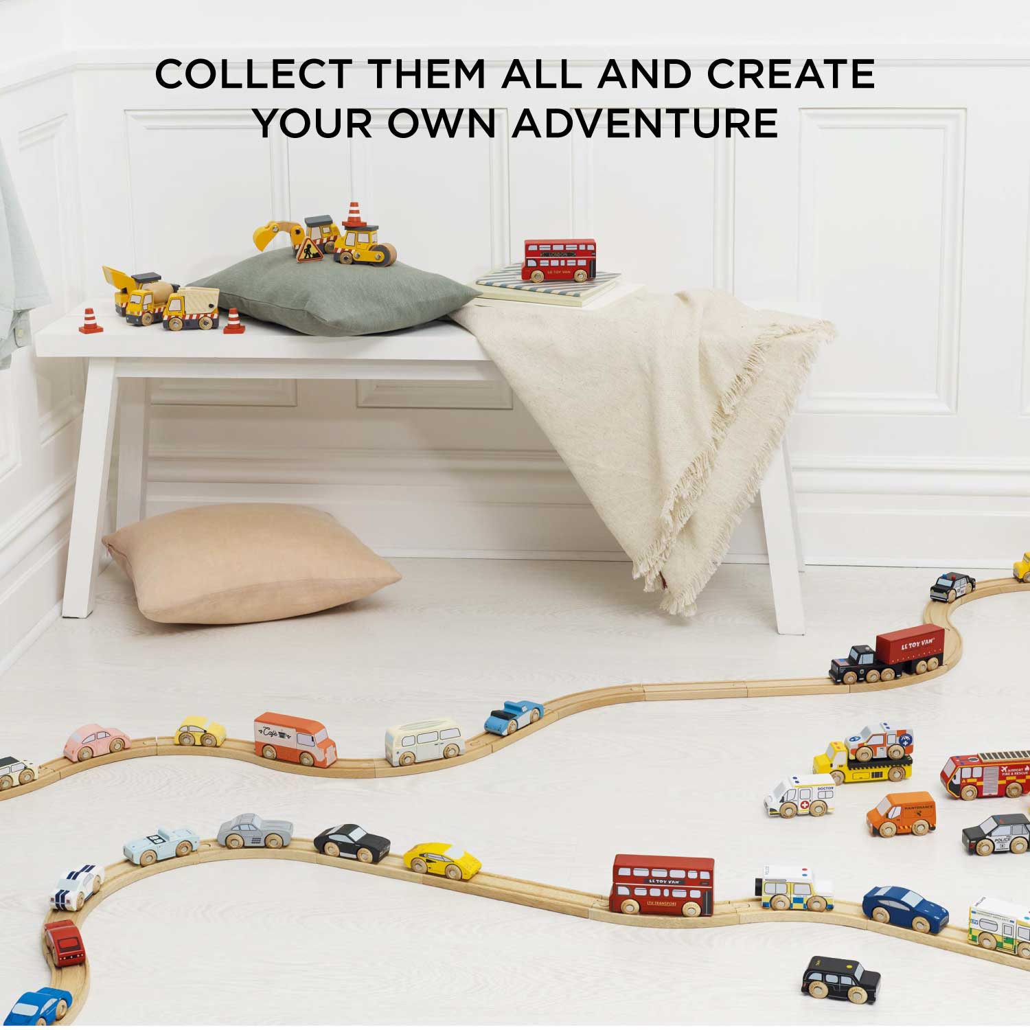 Wooden toy train set on a light-colored floor with text 'Collect them all and create your own adventure'.