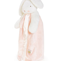 Plush bunny toy with a pink blanket on a white background