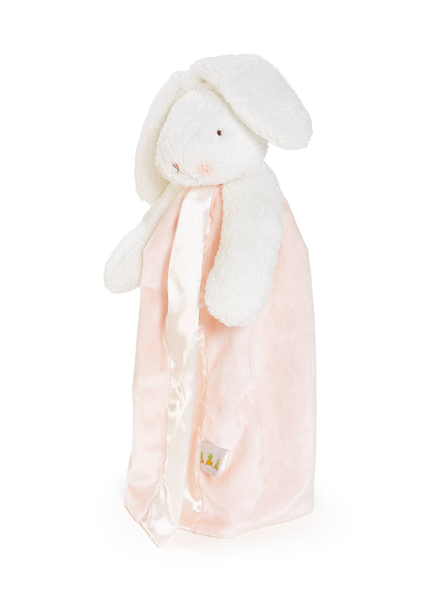 Plush bunny toy with a pink blanket on a white background