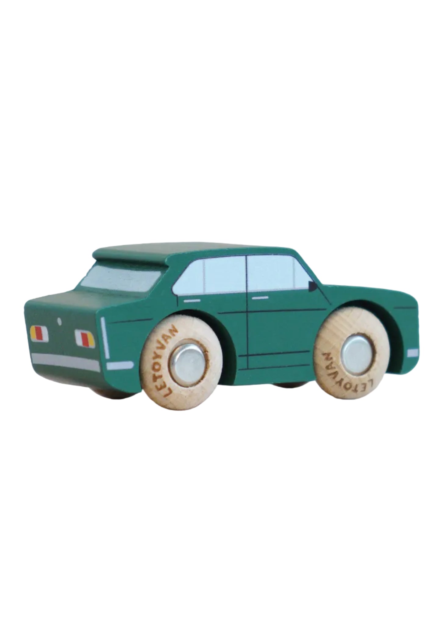 Green toy car with wooden wheels on a beige background