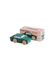 Green toy car next to its packaging box on a beige background