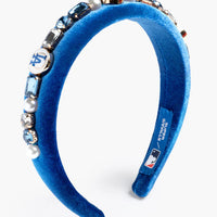 Blue headband with decorative elements on a white background
