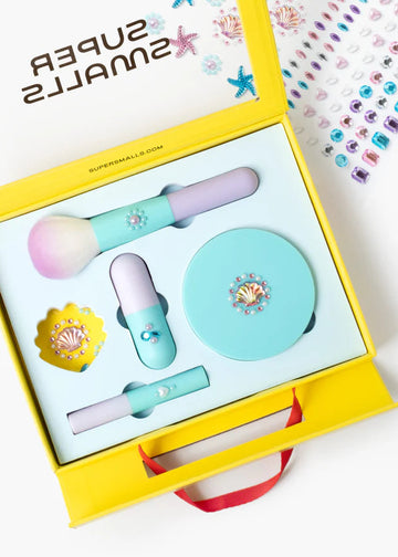 Set of beauty tools including a brush, compact mirror, and small bottle in a yellow box with 'Super Sunkills' branding.