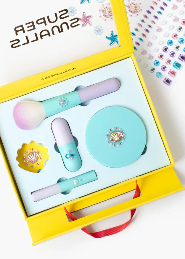 Set of beauty tools including a brush, compact mirror, and small bottle in a yellow box with 'Super Sunkills' branding.