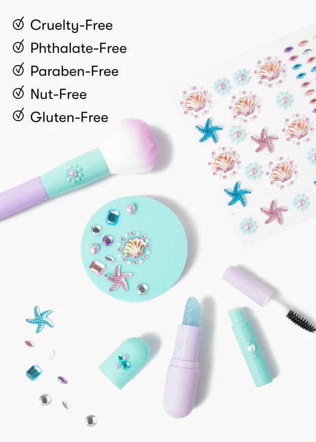 Mermaid-themed makeup set with various tools on a white background, featuring 'Cruelty-Free', 'Phthalate-Free', 'Paraben-Free', 'Nut-Free', and 'Gluten-Free' labels.