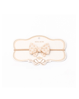 Baby headband with bow on a white background