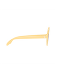 Yellow tongue scraper on a white background