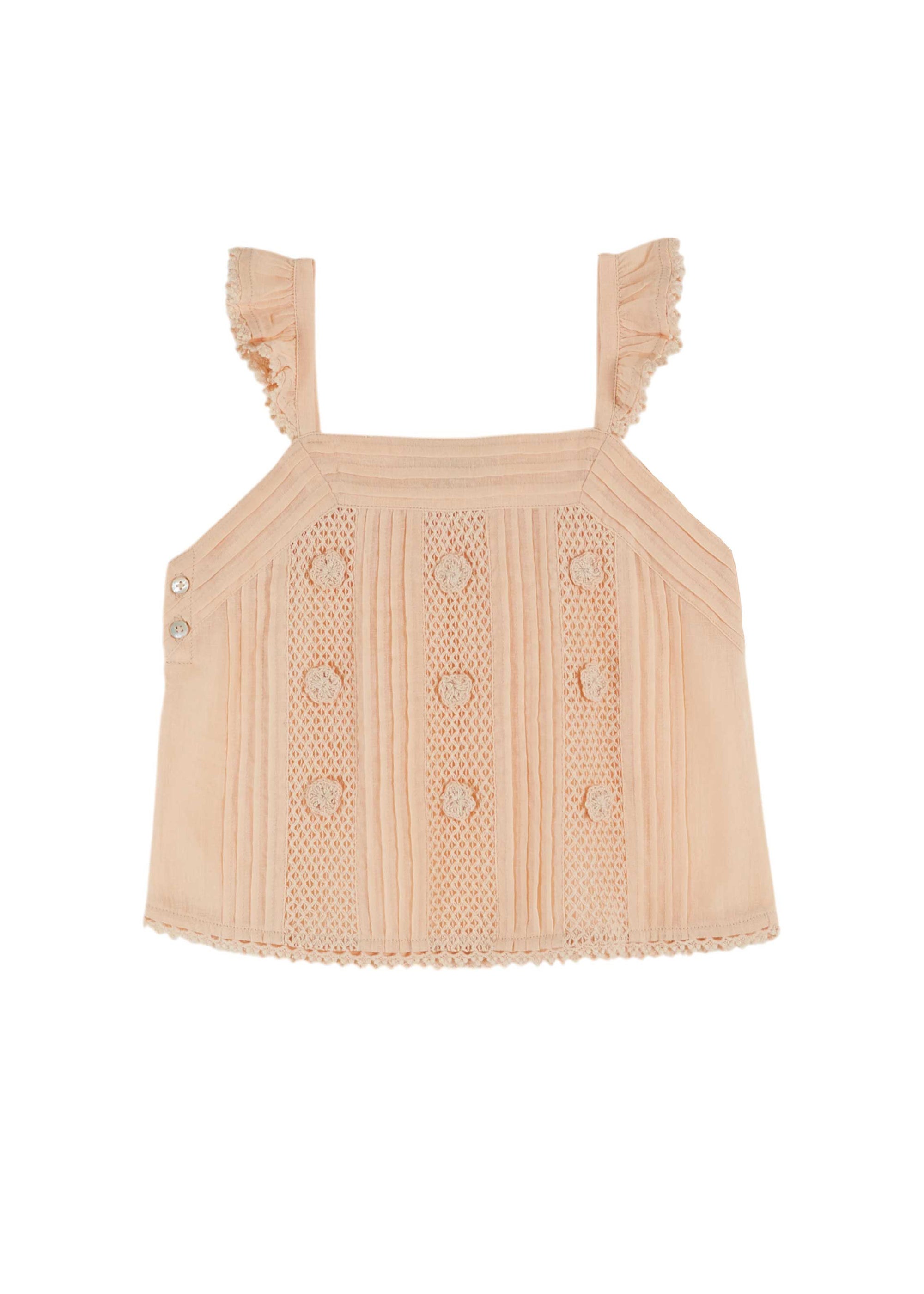 Beige knitted top with ruffled straps on a white background