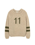 Beige sweater with number 11 on a light gray background