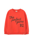 Red sweatshirt with 'The perfect game 92' text on a light gray background