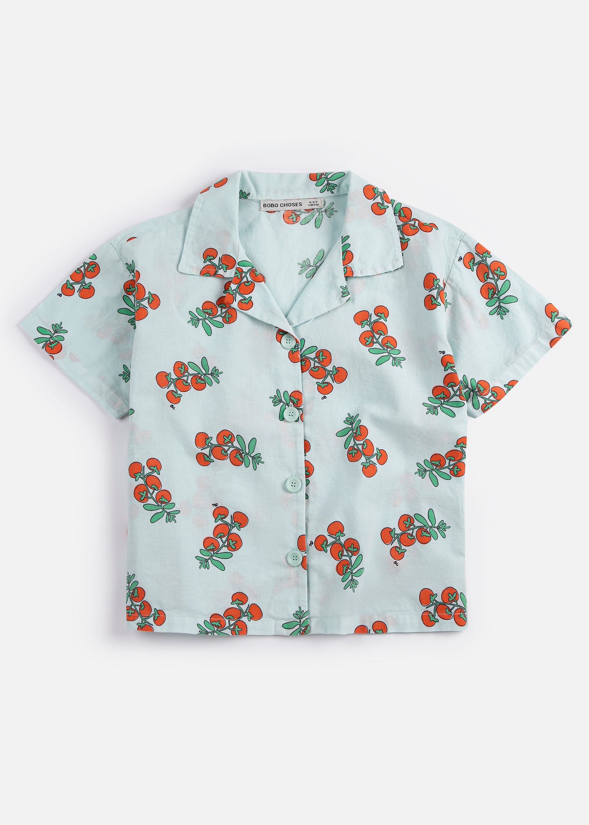 Short-sleeve shirt with cherry pattern on a white background
