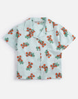 Short-sleeve shirt with cherry pattern on a white background