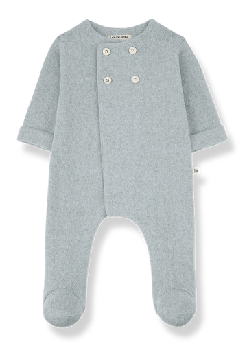 Blue baby onesie with buttons on a white background