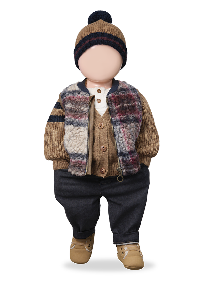 Doll wearing a plaid outfit with a hat on a white background
