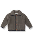 A baby knit cardigan sweater in taupe brown with dark navy blue trim and brown buttons, displayed flat against a white background.