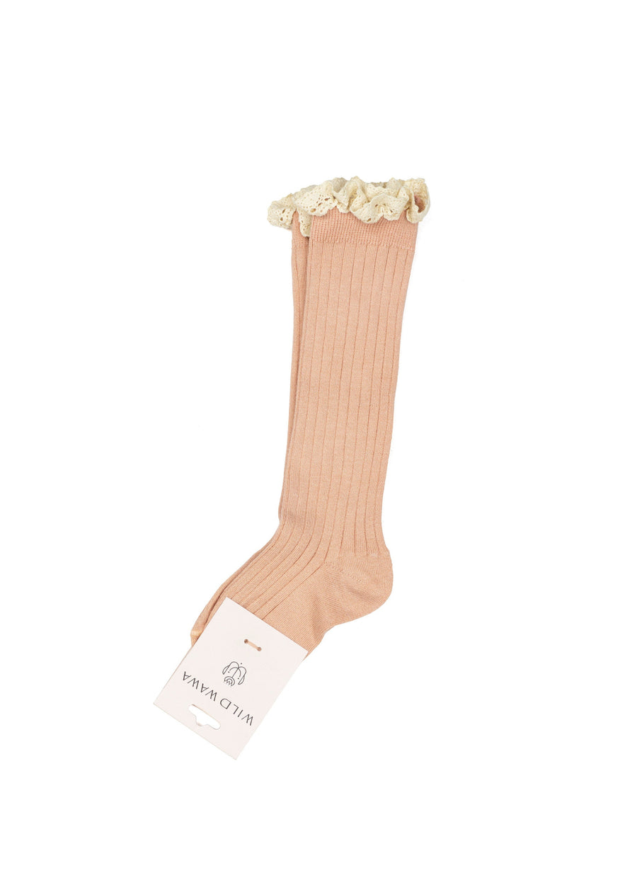 Beige knee-high sock with floral top on a white background