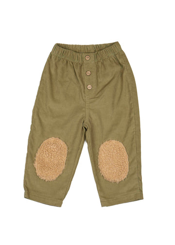 Green pants with beige patches on a white background