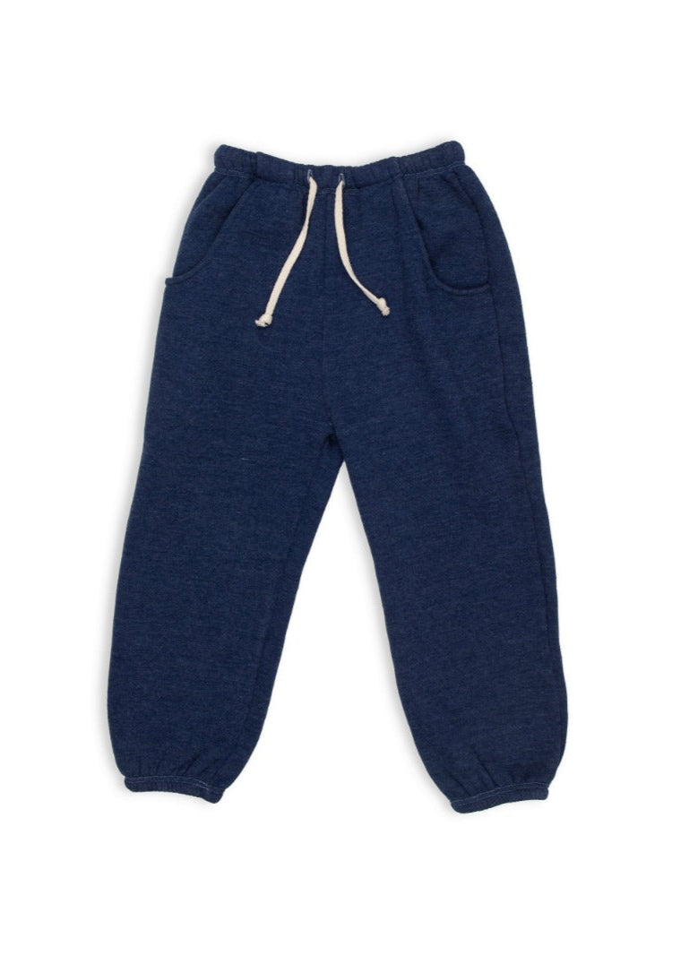 Navy blue jogger pants with a white drawstring on a white background