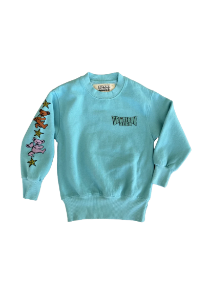 A light blue crewneck sweatshirt featuring a 'Grateful Dead' style logo on the chest and a sleeve decorated with three Grateful Dead-style bears in brown, pink, and yellow stars.