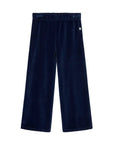 A pair of dark navy blue velvet wide-leg pants with an elastic waistband, shown flat against a light gray background.