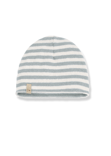 Striped beanie hat with a small logo tag on a white background