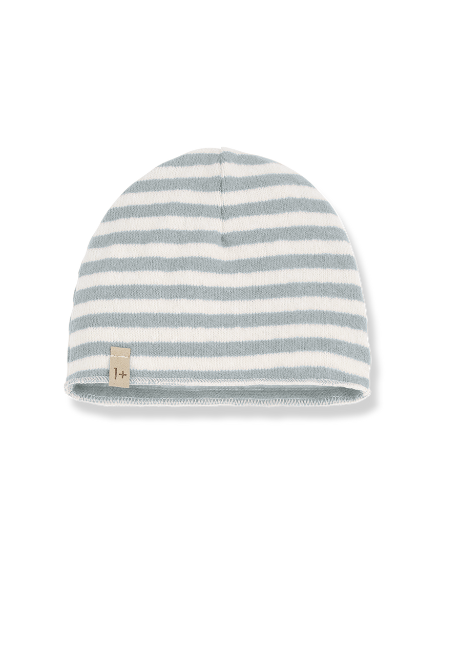 Striped beanie hat with a small logo tag on a white background