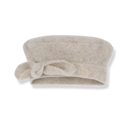 Beige towel with a knot on a white background