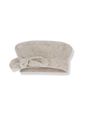 Beige towel with a knot on a white background